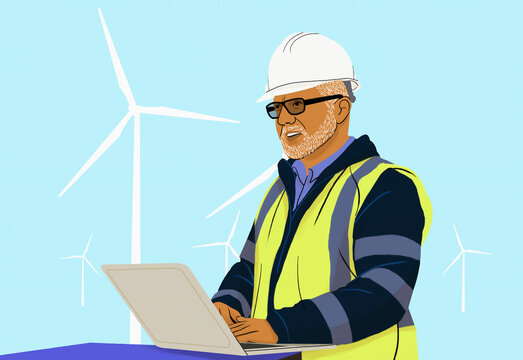 Male engineer with laptop working at wind turbine farm
