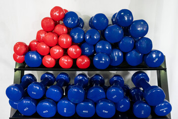 Stack of 3 and 4-kilogram fitness weights, symbolizing strength and determination. Perfect for health and exercise-related projects.
