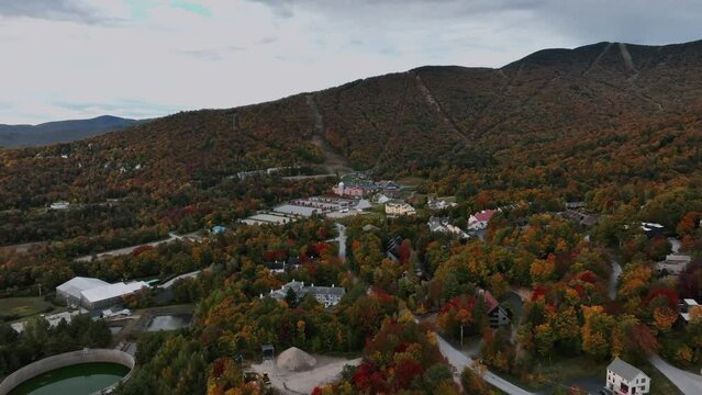 Accommodations By The Mountain Amidst Fall Foliage In Killington Ski Resort In Vermont, USA. aerial shot