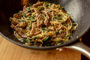 delicious Korean dish: veal in a wok close-up