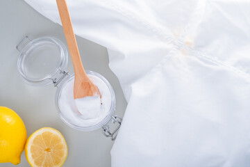 Homemade cleaning yellow sweat stains the armpits on a white T-shirt. Eco-friendly cleaning...