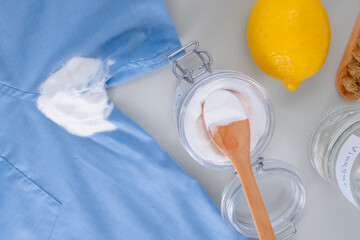 Homemade cleaning sweat stains the armpits on a T-shirt. Eco-friendly cleaning products white...