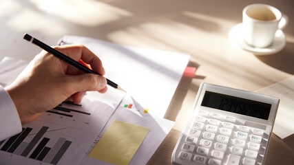 Desk with calculators for calculating, managing and
analyzing economic profits and losses.