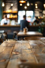 Empty wooden table in a coffee shop. A barista is working in the background. For advertising various products