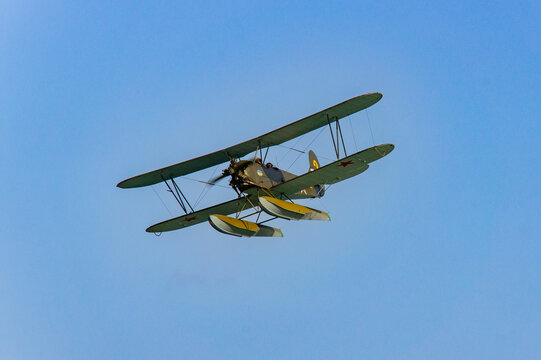 Cloudless sky. Hydroaviation show - 2012.  All-weather Soviet biplane seaplane Polikarpov Po-2 or U-2 (NATO "Mule") in flight. Gelendzhik, Russia - September 04, 2012