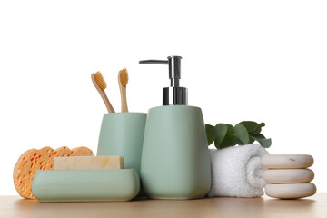 Bath accessories. Different personal care products and eucalyptus branch on wooden table against white background