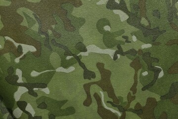 Texture of camouflage fabric as background, top view