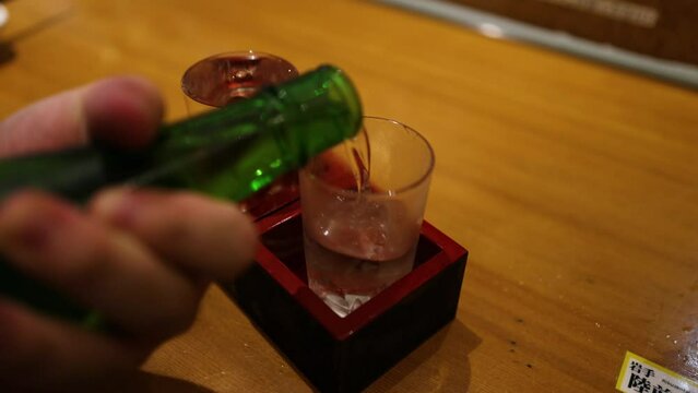 Pouring Sake into Glass