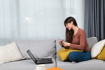 Young senior university student woman of economy and finance working freelance online education job...