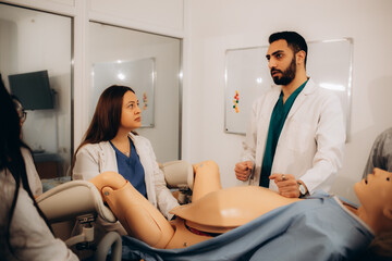 a teacher with a student at a practical childbirth class