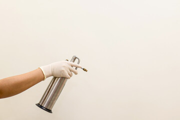 Dermatologists checking liquid nitrogen to treat skin diseases, Cryotherapy treatment. - obrazy, fototapety, plakaty