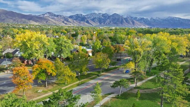 flying over liberty park and 700 east street with beautiful view from mountains in Salt Lake City Utah