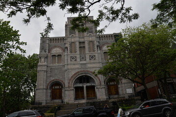 Obraz premium Scenic view of Saint Charles Catholic Church in Montreal, Quebec under a cloudy sky