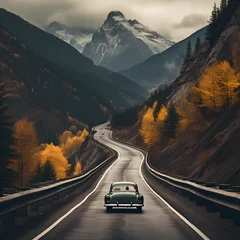 Poster A winding mountain road with a vintage car. © Cao