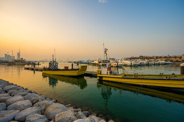 Fototapeta premium Golden Hour at Marina Crescent with Service Boats, Salmiya, Kuwait