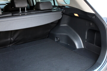 Premium SUV open trunk. Open empty trunk in the modern SUV. Car boot space shot. Modern SUV open...