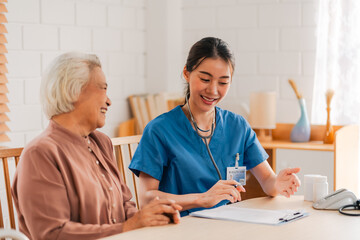 nursing home assistance in health insurance business concept, asian woman doctor or nurse caregiver support health care to elderly senior patient person, caretaker in medicals care recovery service - 752168767