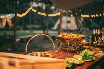 Group of diverse friend having outdoors bbq party together, camping activity lifestyle in summer, cooking fun and happy together with friends or family person group having relax in vacation time - obrazy, fototapety, plakaty