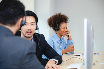 Customer service, call center or telemarketing team and manager or mentor looking happy reading online feedback or sale on website. Diversity people, support sales consultant training office - 752169501