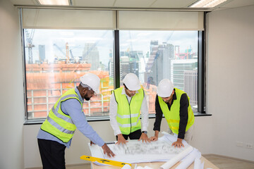 Engineer, Architect and interior team are working, planning, brainstorming and reading a blueprint at a building site. Built structure renovation, development or reconstruction, collaboration in team.