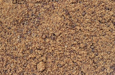 Granulated Sugarcane Jaggery or Indian Gur Background with Copy Space in Horizontal Orientation