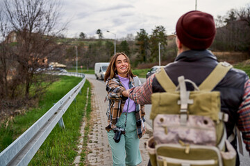 Adventurous duo enjoying a lighthearted moment during a road trip.