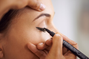 Woman, makeup and eyeliner with mascara pencil for beauty, cosmetics or art at salon or spa....