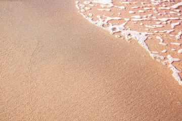 Fototapeta na wymiar Golden sand, beach, wave on sunny time