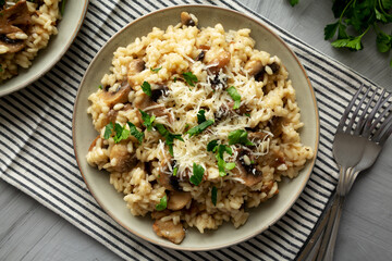 Homemade One-Pot Bacon And Mushroom Risotto on a Plate, overhead view. Flat lay, top view.