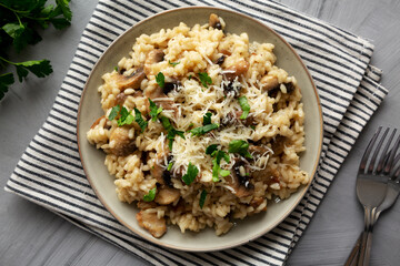 Homemade One-Pot Bacon And Mushroom Risotto on a Plate, overhead view. Flat lay, top view.