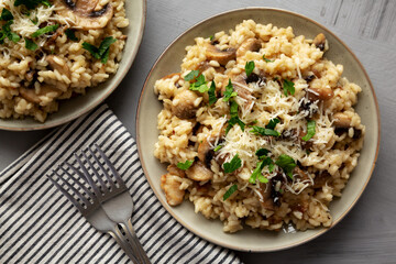 Homemade One-Pot Bacon And Mushroom Risotto on a Plate, overhead view. Flat lay, top view.