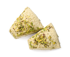 Pieces of tasty halva with pistachios on white background, top view