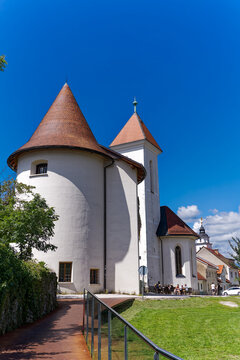 Catholic Church of St. Sebastian, Fabian and Roch at Pungart with cafe at the old town of Kranj on a sunny summer day. Photo taken August 10th, 2023, Kranj, Slovenia.
