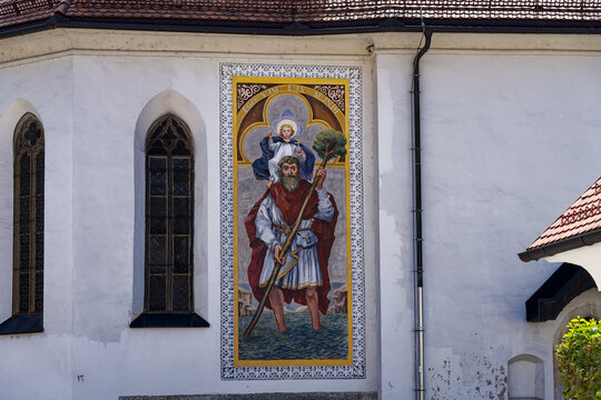 Facade of catholic Church of St. Sebastian, Fabian and Roch at Pungart with colorufl painting at the old town of Kranj on a sunny summer day. Photo taken August 10th, 2023, Kranj, Slovenia.