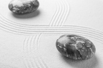 Stones on sand with pattern. Zen concept