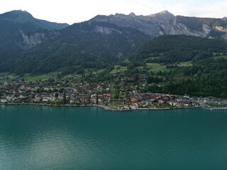 Fototapeta na wymiar View of lakeside town and Switzerland Mountains