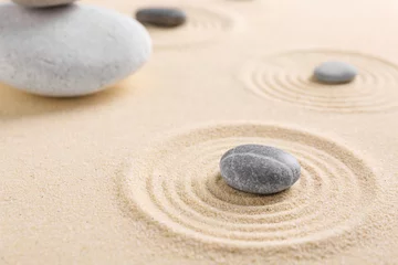 Poster Zen garden stones on sand with pattern, closeup. Space for text © New Africa