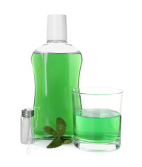 Mouthwash, dental floss and mint isolated on white