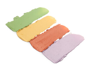 Different color correcting concealers isolated on white