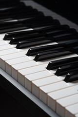 A close-up of piano keys in black and white, highlighting the contrast between them.