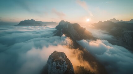 Sunrise over the clouds in the mountains - obrazy, fototapety, plakaty