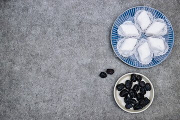 eid al fitr or aldha, ramadan concept iftar and breakfast. makrout algeria cookies made from almond paste and covered with icing powder, Ajwa dates