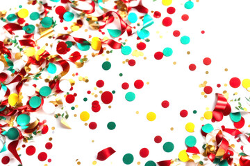 Festive background of multicolored scattered confetti.