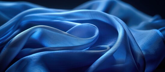 Detailed view of a vibrant blue cloth, showcasing its texture and color.