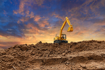 Crawler excavator with are digging the soil in the construction site on the sunset  backgrounds,And bucket lift up.
