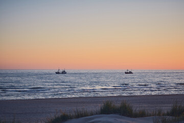 Fishing boats on the sea during sunset. High quality photo