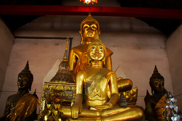 Ancient old buddha in antique ruin ubosot of Wat Nang Kui Temple for thai people travelers travel...
