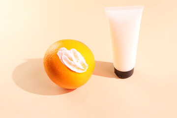 Anti cellulite concept, anticellulite cosmetic bottle mockup, smash and orange fruit