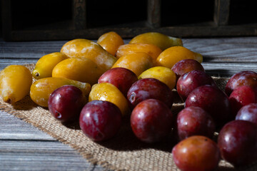 Several small yellow and purple plums, very sweet.