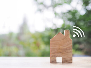 Miniature house with Wifi signal. The concept of network connect, internet of things, smart home...